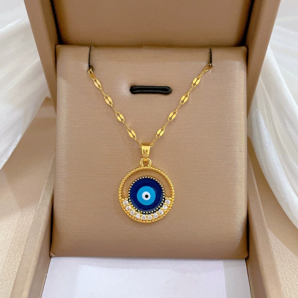 Colgante ojo turco dorado con incrustaciones nazar protector