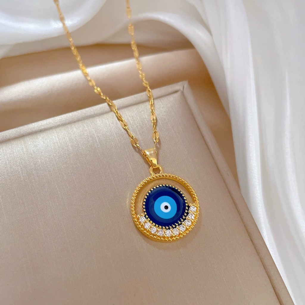 Colgante ojo turco dorado con incrustaciones nazar protector Xinjiang